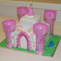 Cinderella Castle Vanilla cake covered in fondant. I cheated and bought the towers from publix, but I thought they turned out ok. TFL