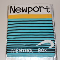 Newport Cake Ok this was a first. They wanted the cake to look like a pack of newport cigarettes. Red velvet covered in fondant. TFL