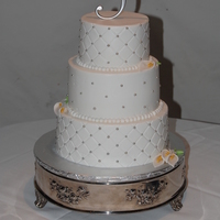 Quilted Wedding Red velvet with buttercreme icing. Silver beads with gum paste cala lillies