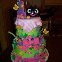 Ladybug Cake 2 tier cake with Lady bug individual Smash cake on top. Vanilla and Chocolate cake with Buttercream icing and fondant figures