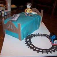 Woody Cake A Birthday cake for 3 children, vanilla cake with buttercream and fondant figures of Woody for one child, thomas for another and the...