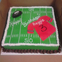 Football Cake simple 12" cake bc icing ,fondant decor, texas sized cupcake for smash cake