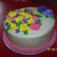 Practice On Flowers This is a practice cake I gave to my mother-in-law. It is a lemon cake with bc icing. The flowers are royal icing with buttercream border....