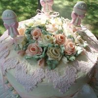 Rattles And Roses Fondant lace and chocolate rattles with buttercream roses