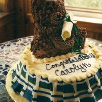 Graduation Cake A bear mascot and a plaid skirt for a field hockey player.