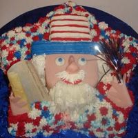 B_1215101253.jpg UNCLE SAM CAKE WITH FONDANT AND BUTTERCREAM. EDIBLE DECLARATION AND HANDS MADE OUT OF FONDANT. INSIDE HAD LAYERS OF BLUE WHIPPED ICING.