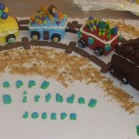 Train Cake This is the first cake I sold. 3D train cake made with loaf and mini loaf pans. Was made for a little boy's first birthday.