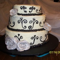 Wedding Cake i made the roses out of fondant then painted them with the silver dust
