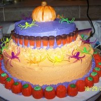 Halloween Cake Its a two teir cake and the pumpkin ontop i made of fondant.. then hand painted it.