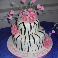 Zebra And Bows A 10 inch and 6 inch vanilla madeira with strawberry and buttercream filling. Gumpaste bows and stars and hearts on wires covered in...