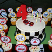 Lightning Mcqueen Birthday Made this for my son's Lightning McQueen birthday party. The cake covered in buttercream and black fondant squares. Made the cupcake...