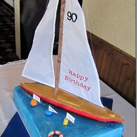 Sailboat Cake This was made for the 90th birthday of a man who made and sailed boats. The sail was made by his daughter. Boat is made of RKT covered in...