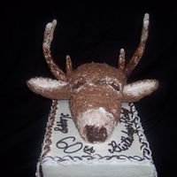 Deer With Antlers Birthday Cake This is a cream cheese with buttcream cake with a deer head made from rice krispy treats and "painted with brown and white buttercream...