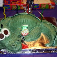 Dragon Cake This is my first attempt at making a 3-D cake. This is a cake mix covered in buttercream. I used fruit rollups for the spine of the dragon...