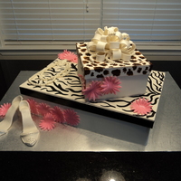 Bridal Shower Cake I made this for a bridal shower. The theme was animal/zebra print. 12x18 white cake and 8x8 chocolate cake. Made the boxes out of gumpaste...