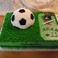 Soccer Graduation this is done in buttercream the soccer ball I used a ball pan and then made a small indent in the sheet cake to get it to sit down in