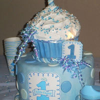 Baby's First Birthday This was a lot of fun to do. This was my second time to work with fondant and my first big cupcake.