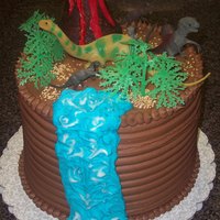 Dinosaur Birthday Cake Dinosaurs, volcano (rice krispie treats) & waterfall on top of 5 layer chocolate cake