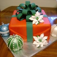 Christmas Present This is my version of Serenatea's beautiful gift cake. 8 in square covered in fondant and gumpaste/fondant bow. Silver dragees and...