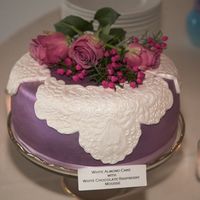 Purple Satin With White Lace The flowers are fresh and the lace is fondant.