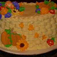 Fall Basket Cake - Course 2 Here is my final cake from Course 2. I made a Fall cake with colorflow pumpkins instead of birds, a tan colored basket, & fall colored...