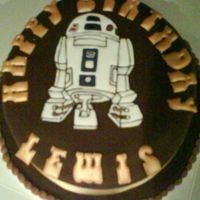 By Son's Birthday Day Chocolate fondant icing, with chocolate butter cream filling!With Royal icing R2D2 and letters, one of my early attempts! As new to this...