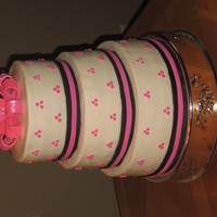 Pink Wedding Cake This is a 3 tier cake. Butter cream icing. Fondant ribbons, gum paste bow.