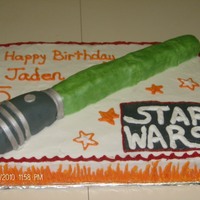 Stars Wars Light Saber Star Wars sheet cake with a RKT light saber covered in fondant.