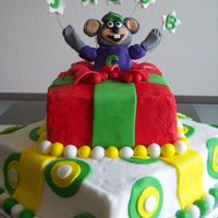 Chuck E Cheese Cake Buttercream Icing with Fondant decorations. For a boy that was having his 4th bday at Chuck E Cheese.