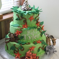 Jungle Baby Shower Cake marble cake with gumpaste animals and fondant leaves..i cut the name out with my new cricut cake machine :) this was my first time making...