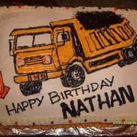 Nathan's Dump Truck Buttercream frosting on yellow cake with strawberry & banana filling.