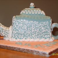 Teapot Cake Fondant covered teapot with gumpaste spout and handle. My mum is mad about teapots so i gave this a bash the RI was added purely to...