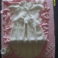 Christening Cake christening gown in a giftbox with tissue paper- everything done in fondant.