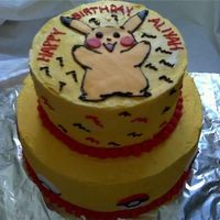 Pokemon Pokemon cake 9 and 6" tiered cake frosted in buttercream. Fondant picachu and pokeballs.