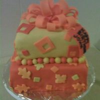 Fall Presents 8" and 6" square cakes covered in fondant with fondant bow. Fall inspired colors.