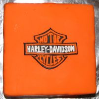 Harley Cake This one way fun...fondant covering with the logo hand cut out of fondant....very time consuming!
