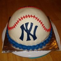 Yankees Baseball Cake i made this cake from the betty crocker cake pans that are easy for fillings. its choc cake with peanut butter filling and butter cream...