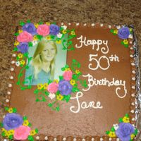 My Moms Chocolate Buttercream 50Th Birthday This is a yellow 2 layer 12 in square cake with chocolate butter cream outside with chocolate wipped cream and choc chip filling. I...