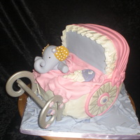 Baby Carriage This cake was a disaster. The handle fell off and it was so heavy. It was all cake and carrot cake at that! Lesson learned