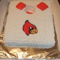 Corn Hole Cake White cake carved to look like a corn hole set. Decorated in buttercream.