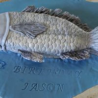 Fondant Fish 2nd time working with fondant, this was made for my son, whom loves toooo .......can us guess..........fish. thanks for looking