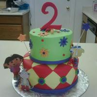 Dora two tier cake with fondant accents, characters are print out