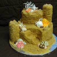 Sandcastle Cake Two tier pina colada cake with rum buttercream for a tropical bridal shower. I used rice crispy treats for the towers, a mixture of sugars...