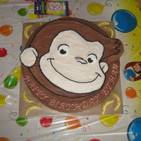 Curious George Birthday Cake 2 layer chocolate/white tinted with copper color buttercream, top layer hand carved using template of george printed from computer,...