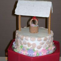 Wishing Well, Heather. First time working with gumpaste. BC icing with gumpaste stones and flowers. The cover is made out of chewing gum. This cake is made for my...