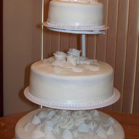 My First Wedding Cake fondant icing with gum paste roses, petals and leaves.