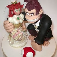 Donkey Kong & Princess Peach I had just finished making this wedding cake topper for a couple of computer game nerds, LOL. The bride found out she was pregnant at the...