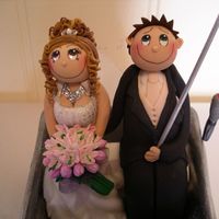 Mad Fisherman The bride & groom are in a sugar dough tinny boat fishing. All edible except the diamantes in the necklace & tiara & fishing...