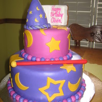 Wizards Of Waverly Place Themed Cake two tier cake, fondant covered decorated with fondand covered cripy treat wizard hat and spell book, "Alex's" wand also made...