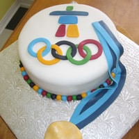 2010 Olympic Cake vanilla cake with fondant Inukshuk, rings, and gold medal